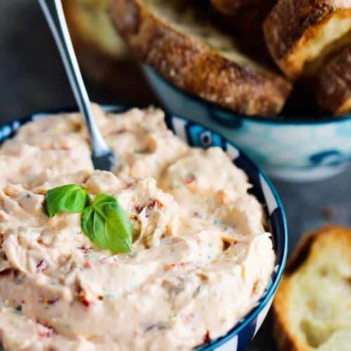 Sun-Dried Tomato and Artichoke Dip in a patterned bowl