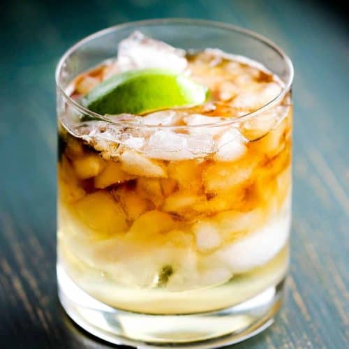 A Dark 'n stormy cocktail in a rocks glass with chipped ice