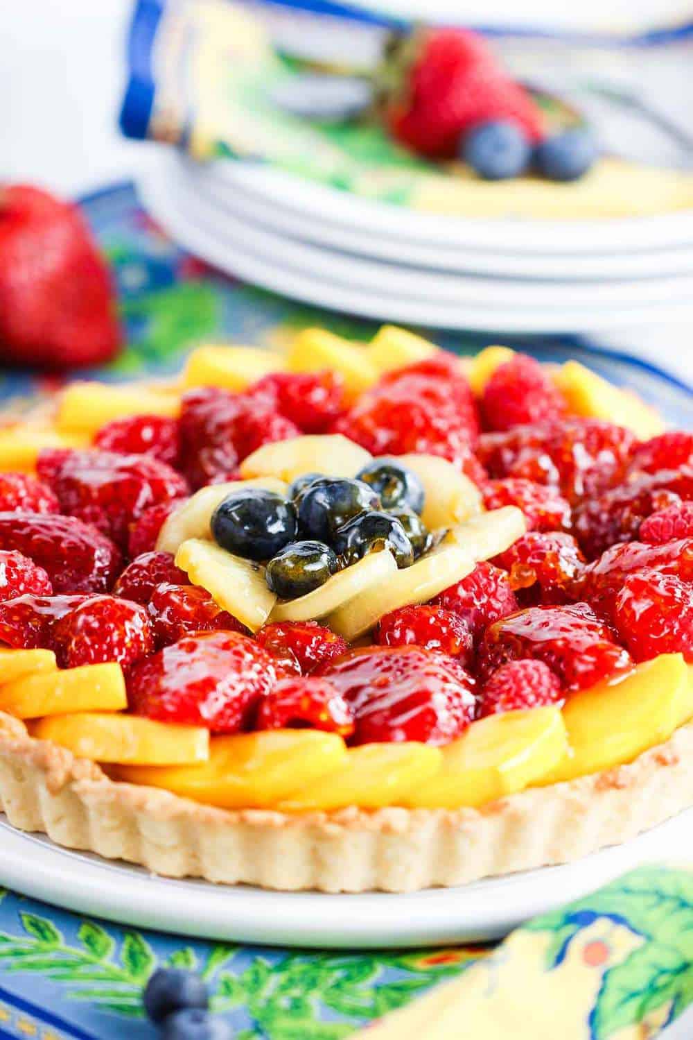 the fruit is layered beautifully in this classic fruit tart