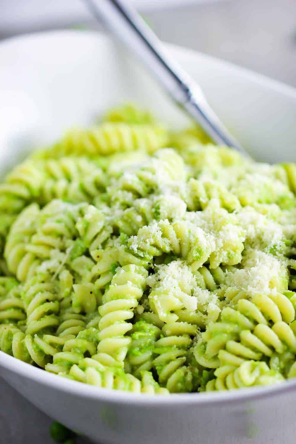 This pea pesto with fusilli is in a bowl ready to be served.