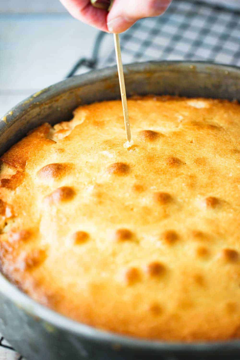 A toothpick inserted and then removed from a baked pineapple-upside down cake.