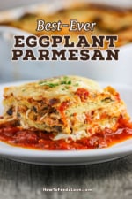 A white dinner plate with a square serving of eggplant parmesan sitting in thin layer of marinara sauce.