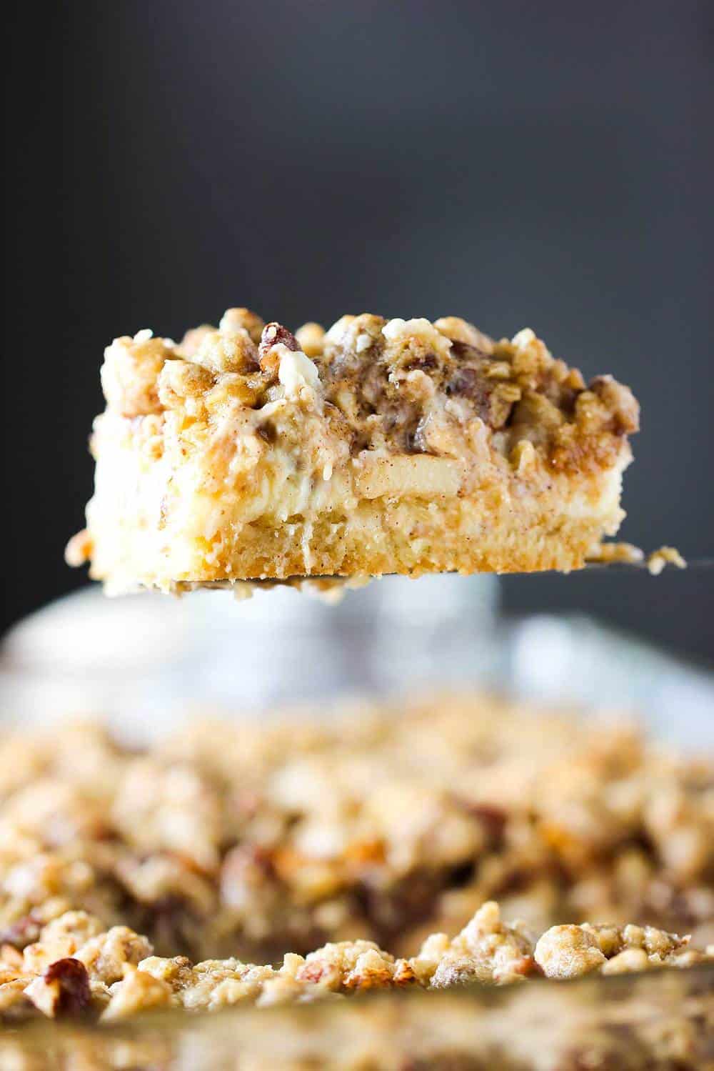 Cream cheese apple bars on a spatula