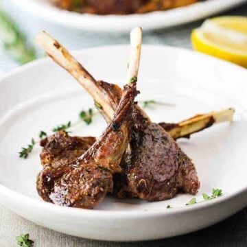 Lamb lollipops in a white bowl