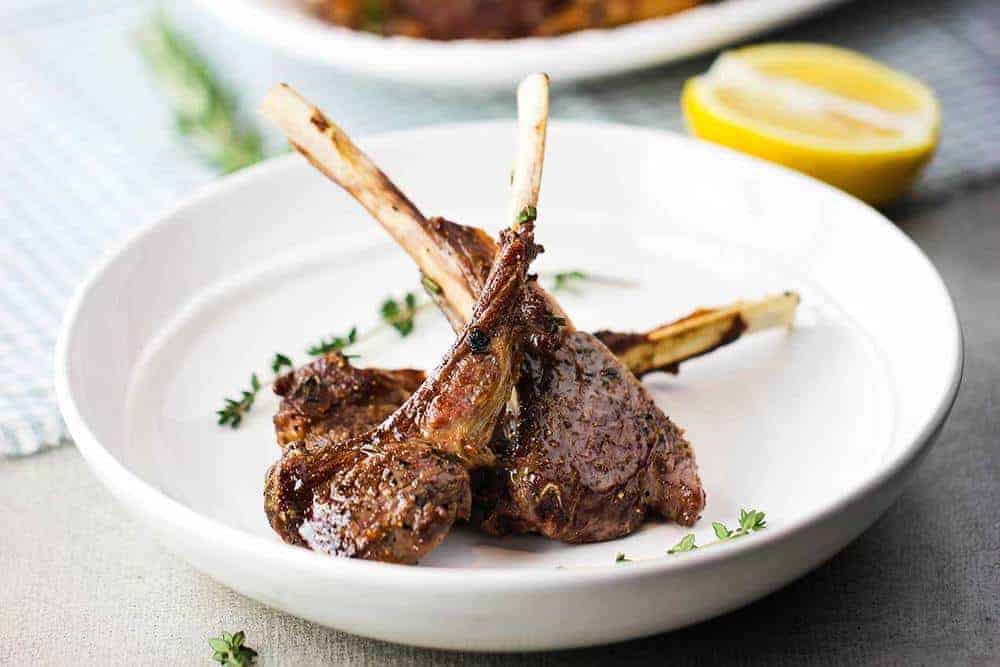 Lamb lollipops in a white bowl