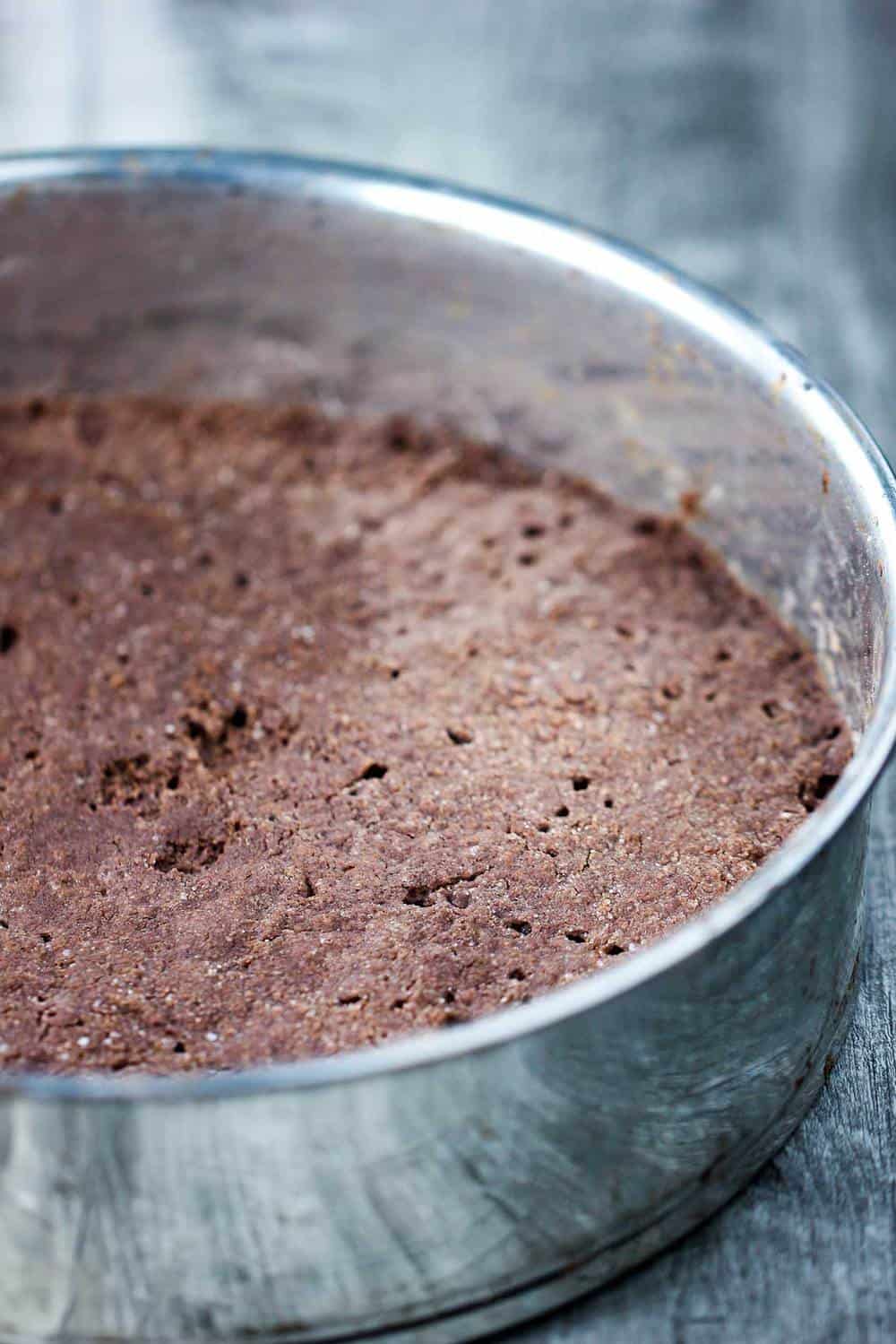 chocolate shortbread crust in a springform pan