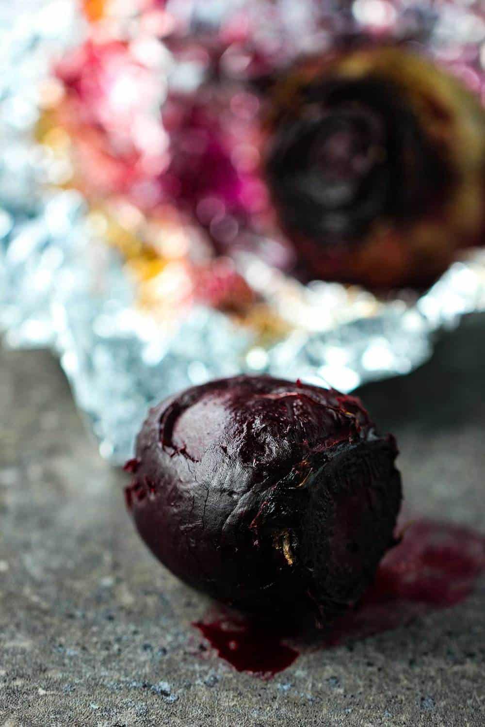 Roasted beet in foil on a counter