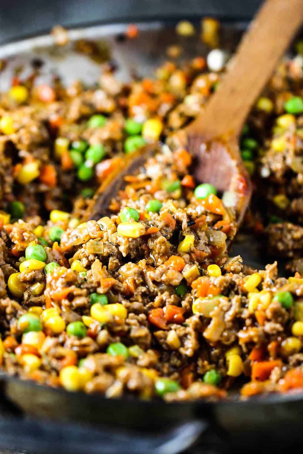 A skillet of ground lamb and vegetables for shepherd's pie