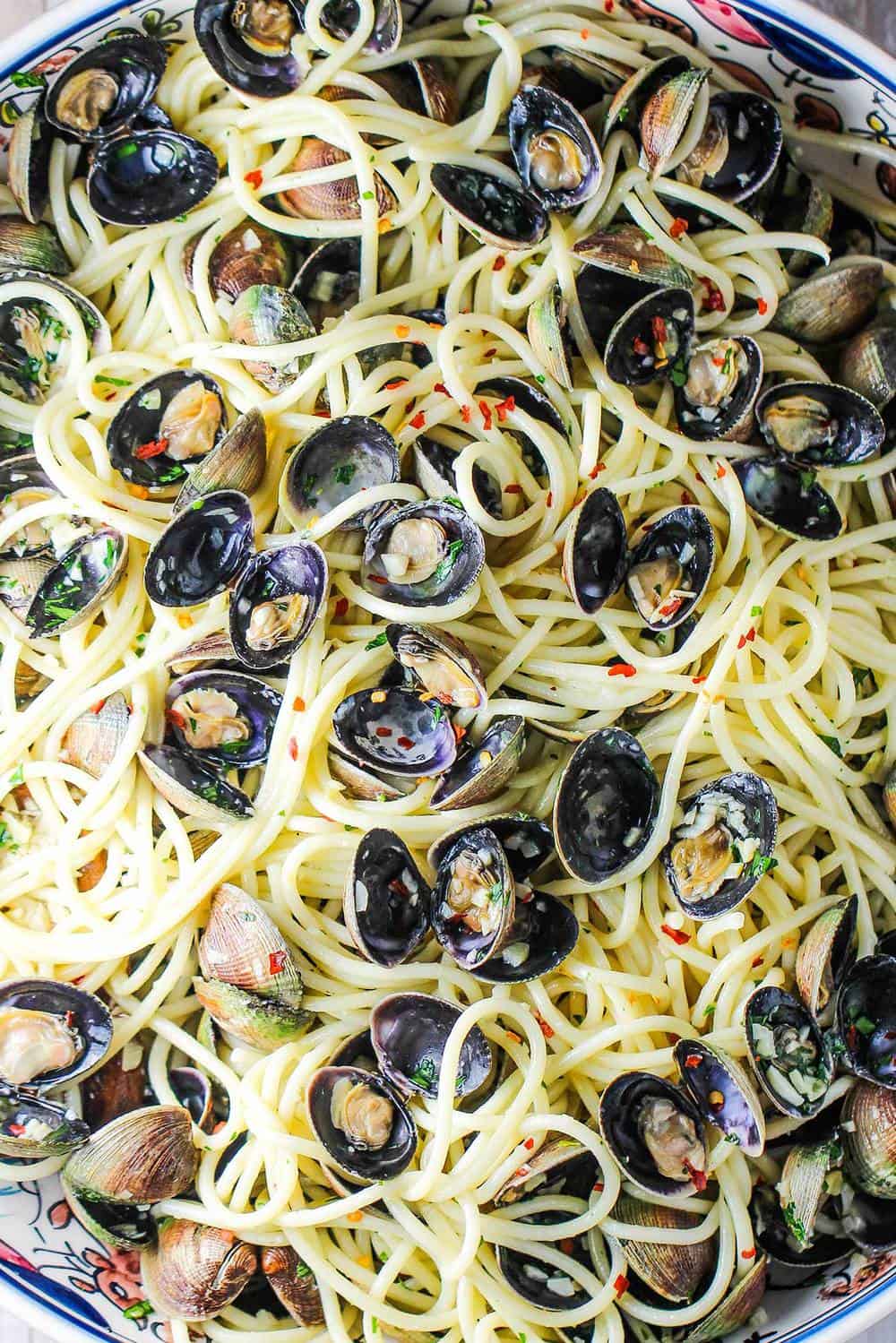 A large pasta bowl of cooked spaghetti vongole