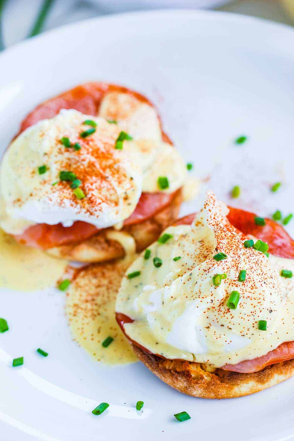 Classic Eggs Benedict on a white plate.
