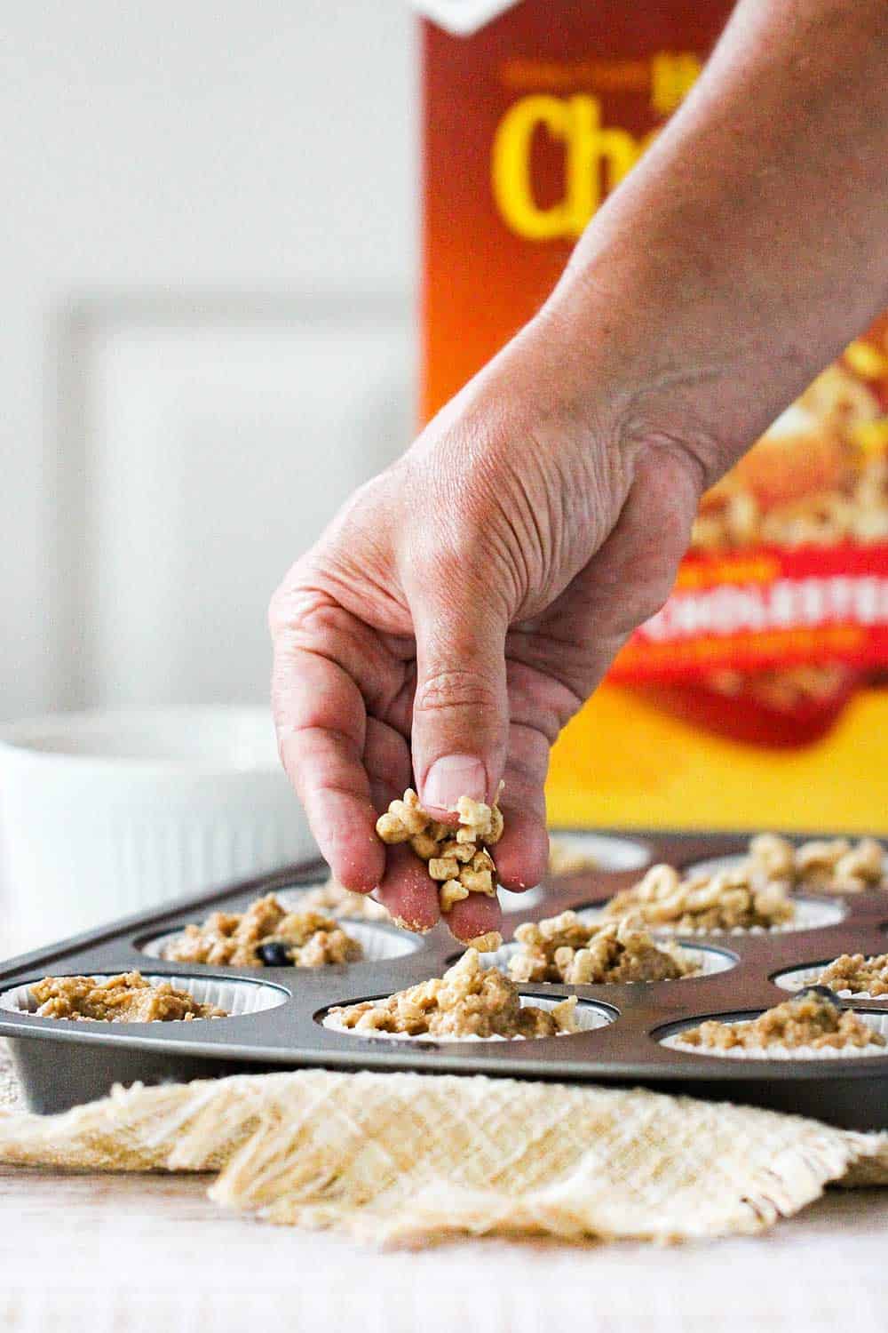 Sprinkle roughly chopped Honey Nut Cheerios on top of the banana blueberry muffins.