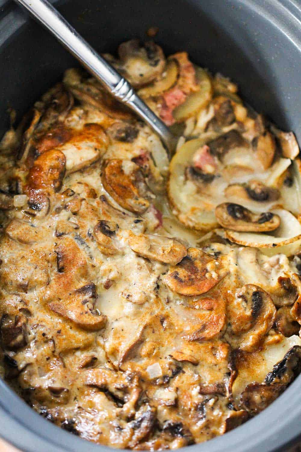 An overhead view of slow-cooker ham and potatoes au gratin. 