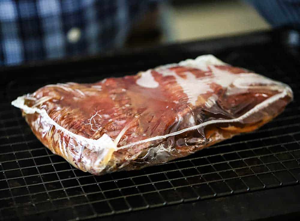 A package filled with cooked Wagyu chuck short ribs. 