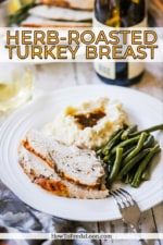 A dinner plate filled with sliced roast turkey breast, mashed potatoes, and green beans.