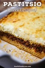 A view looking into a lasagna dish that is filled with pastitsio which consists of a bottom layer of tubular pasta, topped with a meat sauce, and then topped off with a thick Greek bechamel sauce.