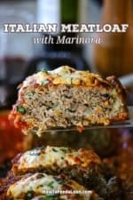 A metal spatula being used to lift up a slice of The Best Juicy Italian Meatloaf with Marinara Glaze.