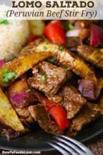 A close-up view of a dinner plate filled with a serving of Peruvian Beef Stir-Fry.