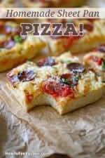 A close-up view of a square slice of sheet pan pepperoni pizza with a bite missing from it.