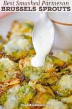 Homemade Ranch dressing being drizzled from a spoon onto a Parmesan Smashed Brussel Sprout over a plate of the same.